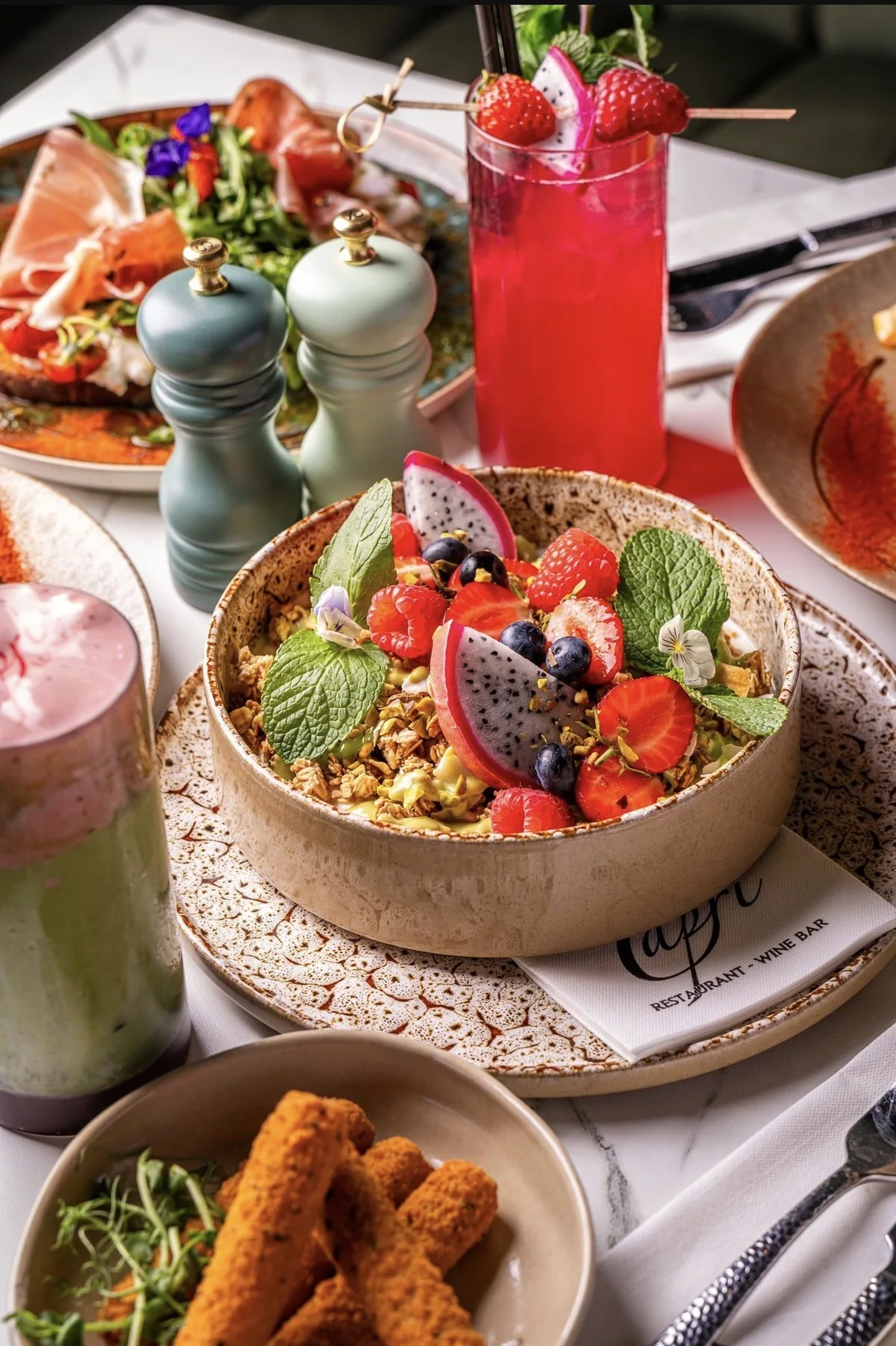 Granola, fruit and refreshers at Cafe Capri Lounge